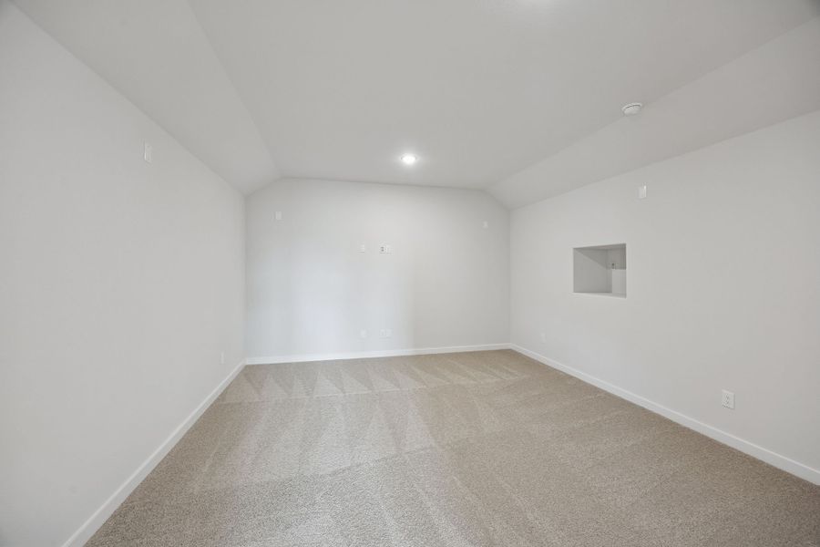 Media Room in the Masters home plan by Trophy Signature Homes – REPRESENTATIVE PHOTO