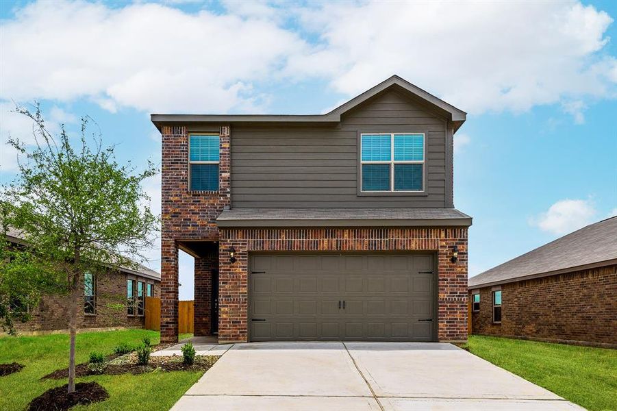 Front of property featuring a garage