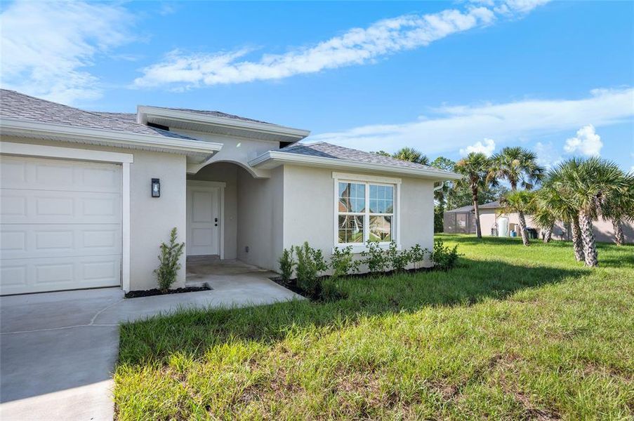 Front exterior of a new home in , North Port, FL, highlighting curb appeal (Image 15). Front exterior of a new home in , North Port, FL, highlighting curb appeal (Image 15).