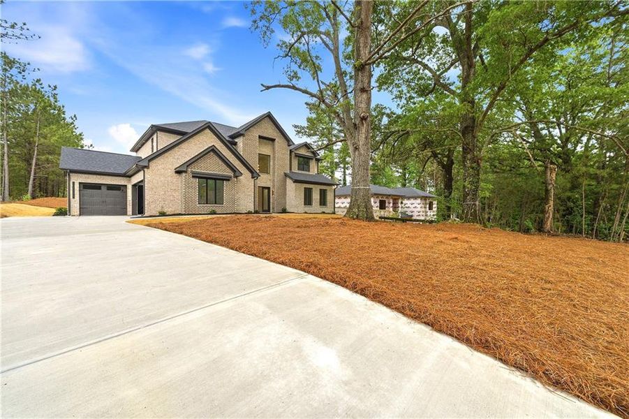 Front exterior of a new home in , Fairburn, GA, highlighting curb appeal (Image 2). Front exterior of a new home in , Fairburn, GA, highlighting curb appeal (Image 2).