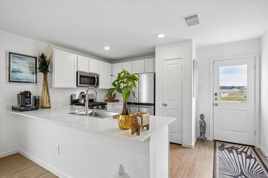 Walking toward the kitchen now -- door to your sizable back yard lies just beyond Walking toward the kitchen now -- door to your sizable back yard lies just beyond