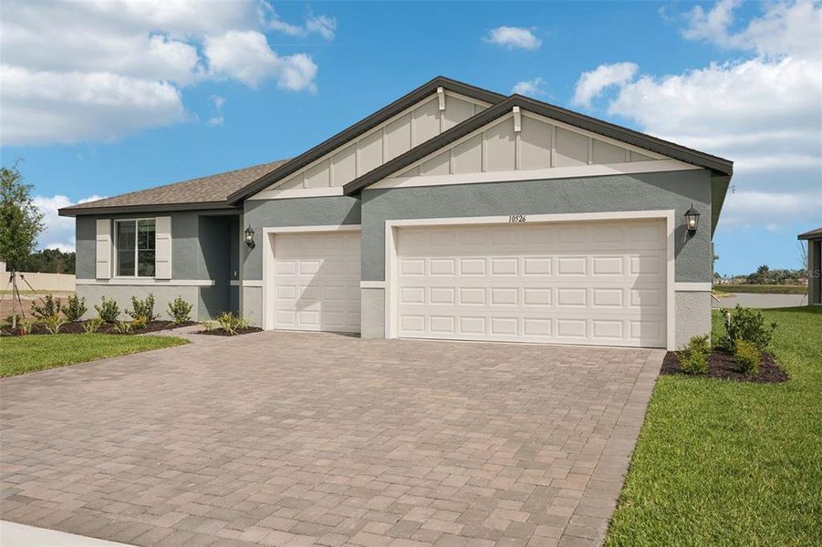 Front exterior of a new home in Oakfield Trails - Signature Series, Parrish, FL, highlighting curb appeal (Image 17).