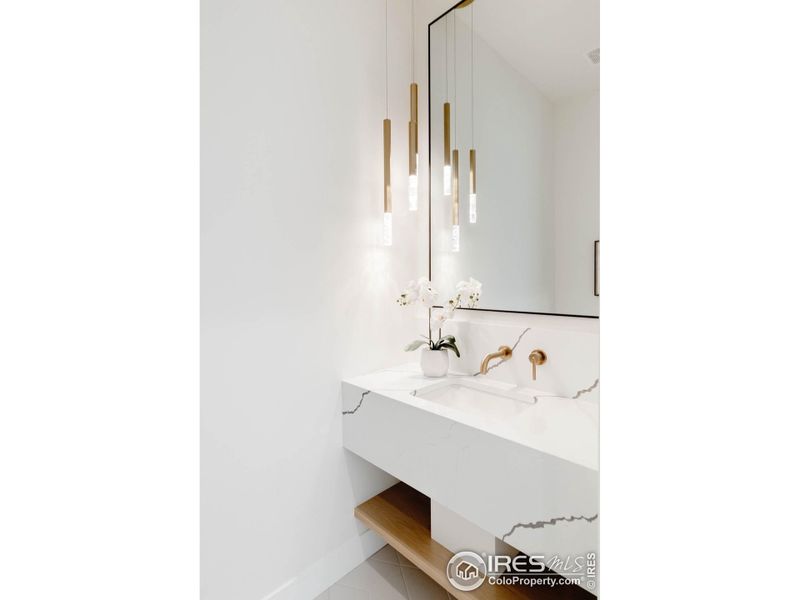 A chic powder room adds convenience on the main floor.