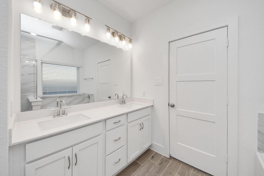 Furnished interior view inside a new home in Sunterra: Landmark Collection, Katy (Image 11).