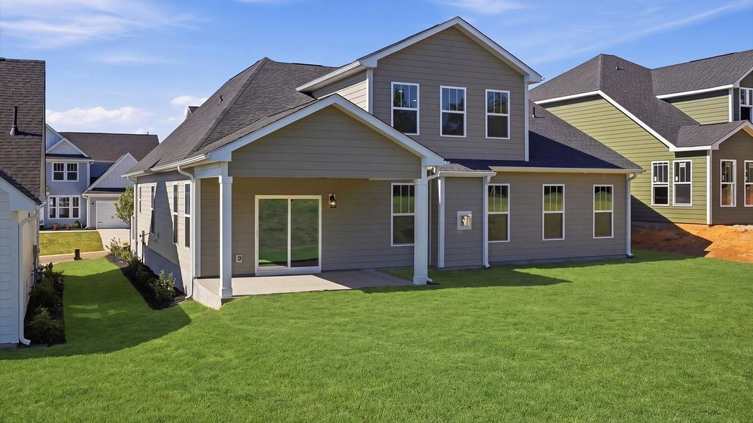 Refined rear exterior with a stylish covered porch for dining, relaxing, or entertaining located at Benjamin's Grove Refined rear exterior with a stylish covered porch for dining, relaxing, or entertaining located at Benjamin's Grove