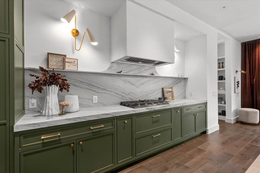 Gorgeous leathered quartzite counters give the kitchen a sleek elegance.
