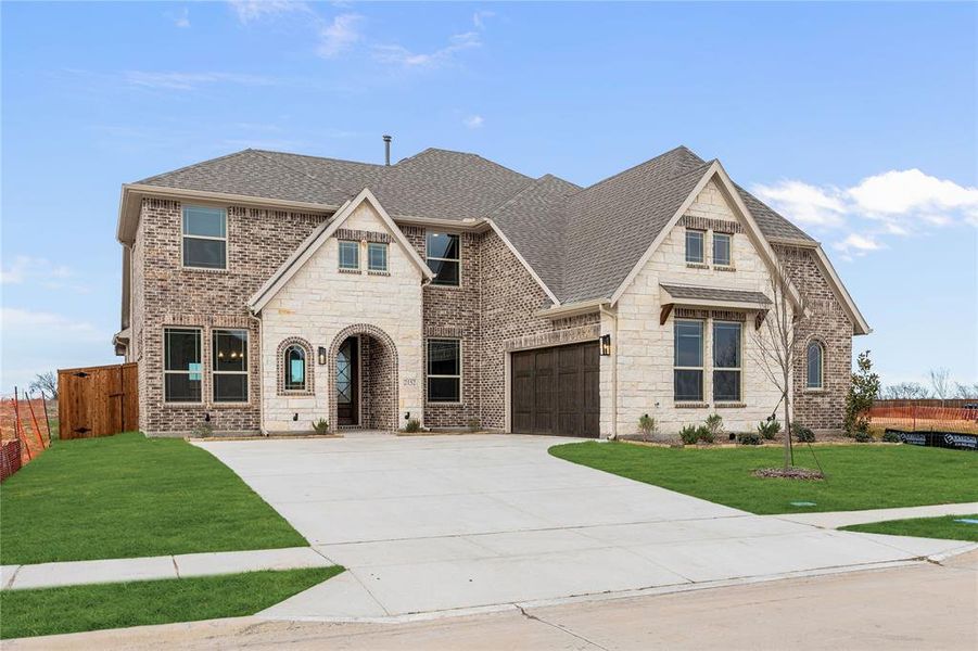 Front exterior of a new home in Stone River Glen 60s, Royse City, TX, highlighting curb appeal (Image 21).