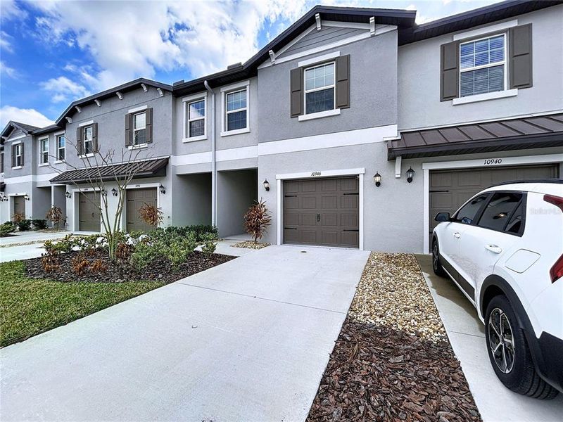 Front exterior of a new home in , Land O' Lakes, FL, highlighting curb appeal (Image 27). Front exterior of a new home in , Land O' Lakes, FL, highlighting curb appeal (Image 27).