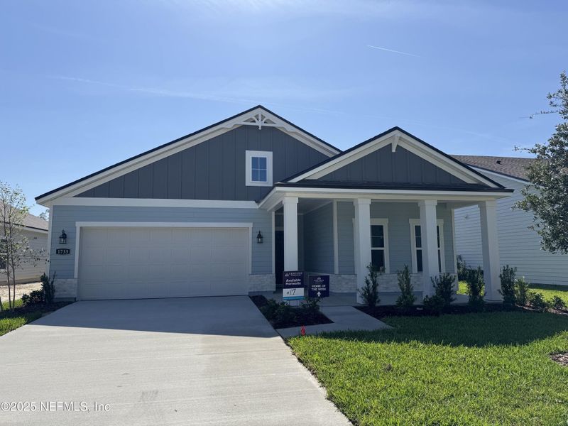 Front exterior of a new home in Oak Creek Preserve, Jacksonville, FL, highlighting curb appeal (Image 2). Front exterior of a new home in Oak Creek Preserve, Jacksonville, FL, highlighting curb appeal (Image 2).