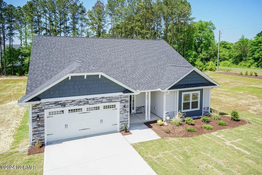 Front exterior of a new home in River Village Square in River Landing, Wallace, NC, highlighting curb appeal (Image 22).