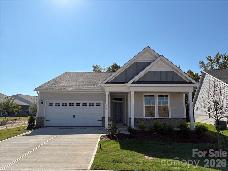 Front exterior of a new home in Cottages at Wingate, Wingate, NC, highlighting curb appeal (Image 1). Front exterior of a new home in Cottages at Wingate, Wingate, NC, highlighting curb appeal (Image 1).