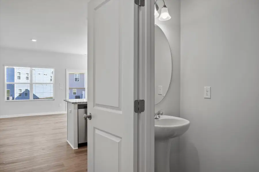Furnished interior view inside a new home in West Main Townhomes, Sanford (Image 3).