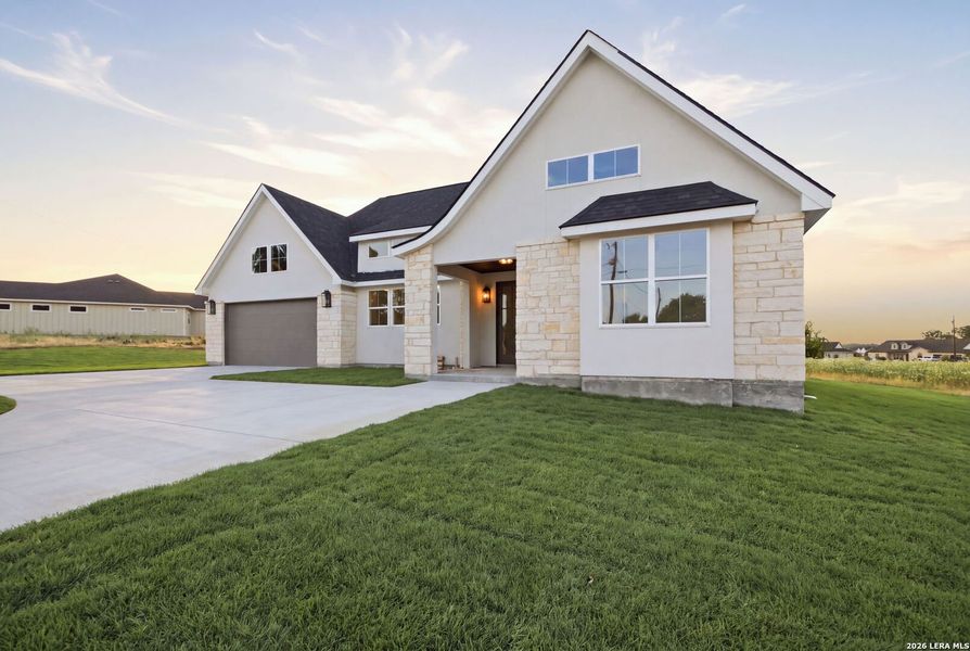 Front exterior of a new home in , Bandera, TX, highlighting curb appeal (Image 26). Front exterior of a new home in , Bandera, TX, highlighting curb appeal (Image 26).