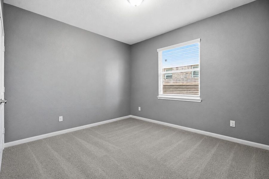 *This photograph has been virtually altered to show the possibility of carpet in the secondary bedroom.