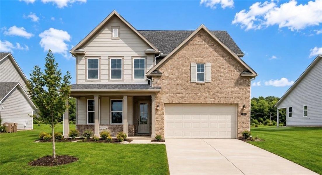 Front exterior of a new home in Wehunt Meadows, Hoschton, GA, highlighting curb appeal (Image 2). Front exterior of a new home in Wehunt Meadows, Hoschton, GA, highlighting curb appeal (Image 2).