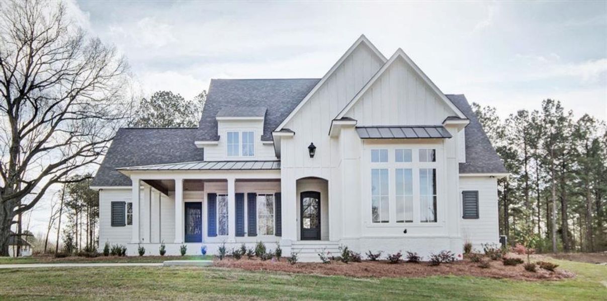 Front exterior of a new home in , Ball Ground, GA, highlighting curb appeal (Image 1).