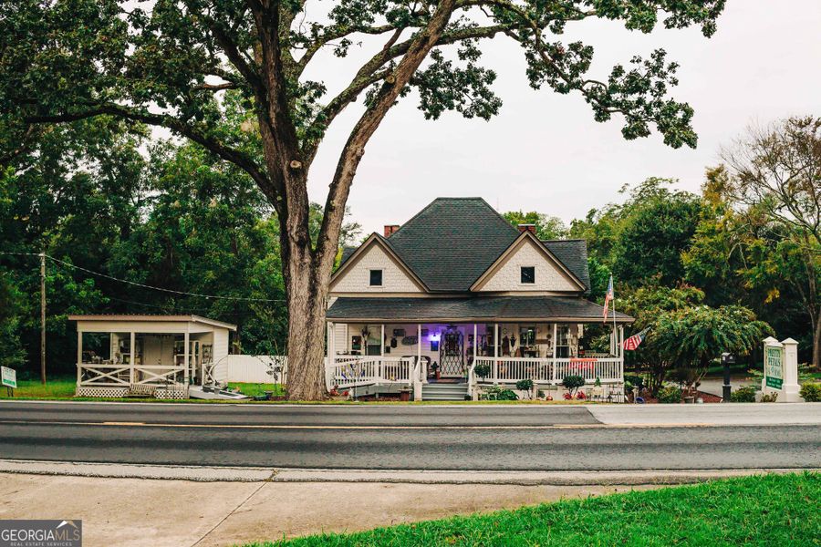 Front exterior of a new home in Rosewood Lake Estates, Hoschton, GA, highlighting curb appeal (Image 32).