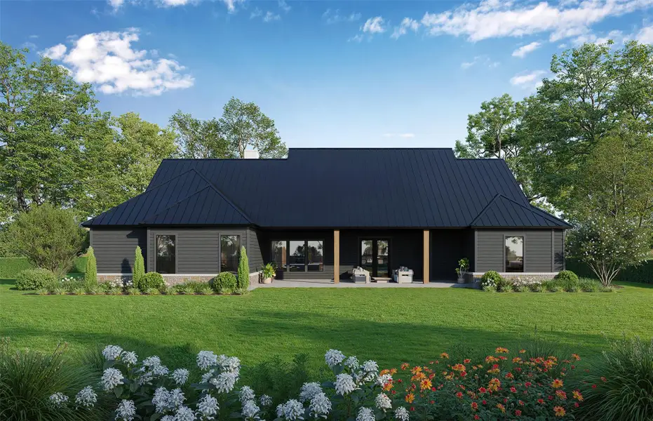 A dark-hued modern home with a deep-pitched roof sits amid a sprawling, verdant yard. A dark-hued modern home with a deep-pitched roof sits amid a sprawling, verdant yard.