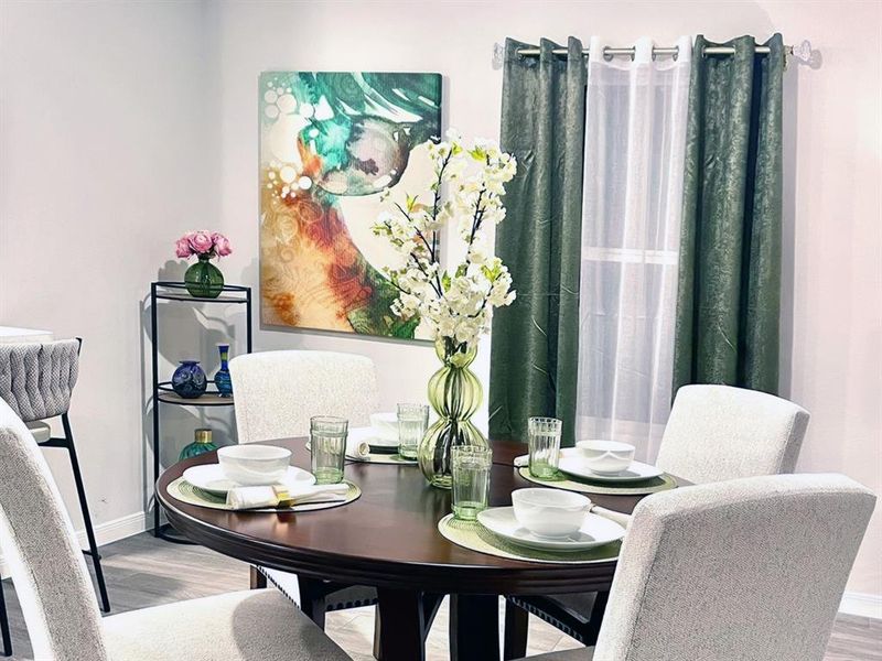 Dining room with baseboards and wood finished floors