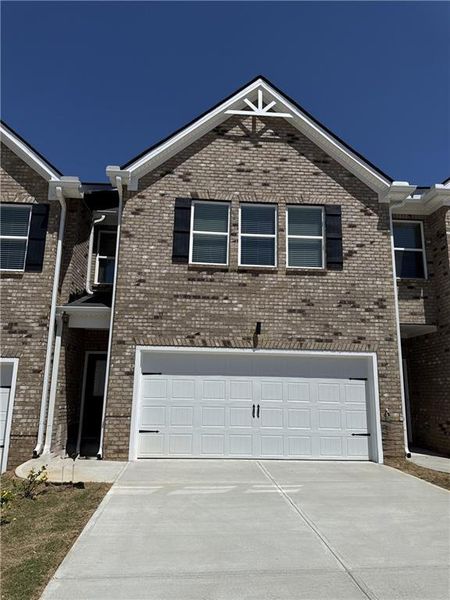 Front exterior of a new home in Parkway James, Snellville, GA, highlighting curb appeal (Image 1). Front exterior of a new home in Parkway James, Snellville, GA, highlighting curb appeal (Image 1).