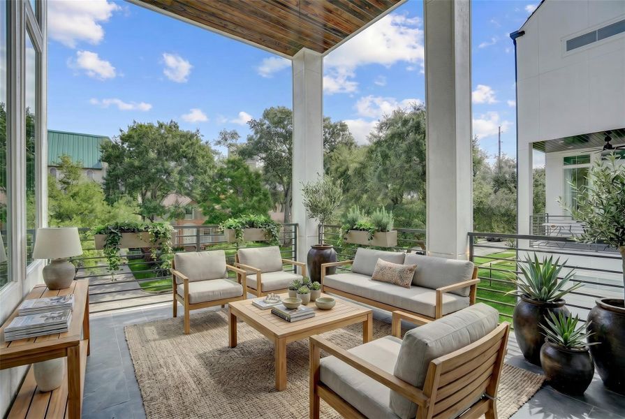 The outdoor terrace off the kitchen with gas connection offers additional living or dining space. Virtually staged photo. The outdoor terrace off the kitchen with gas connection offers additional living or dining space. Virtually staged photo.