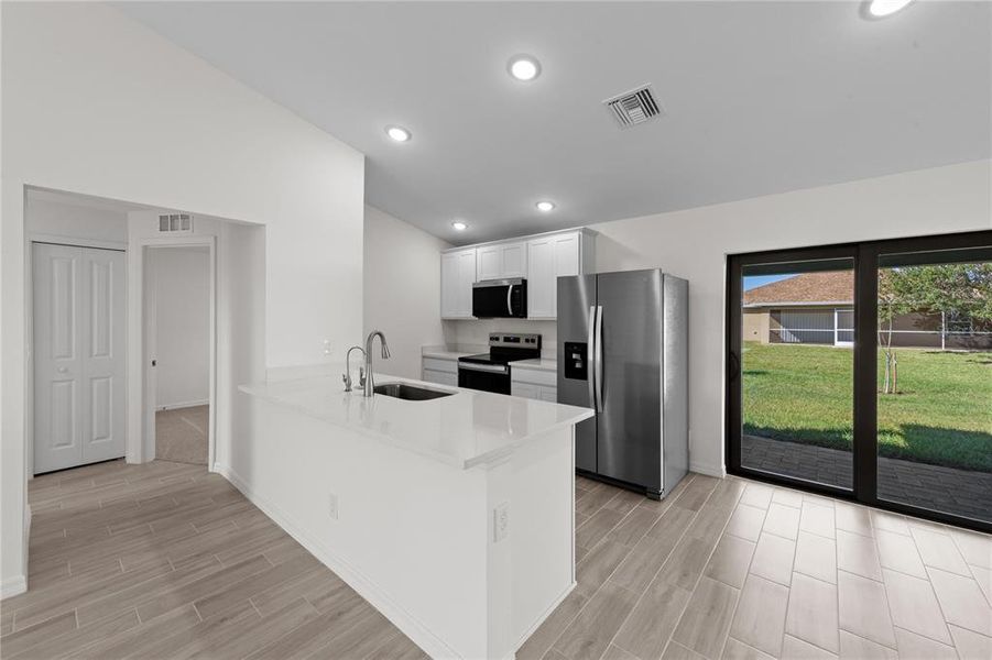 Furnished interior view inside a new home in , Port Charlotte (Image 4). Furnished interior view inside a new home in , Port Charlotte (Image 4).