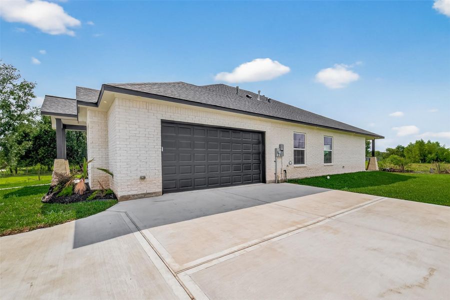 Front exterior of a new home in , Hitchcock, TX, highlighting curb appeal (Image 26).