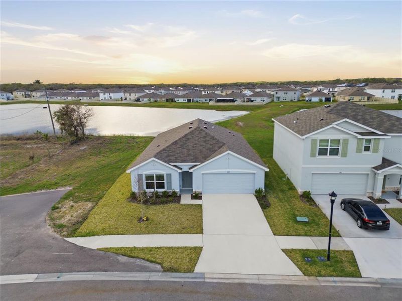 Front exterior of a new home in Berry Bay, Wimauma, FL, highlighting curb appeal (Image 24).