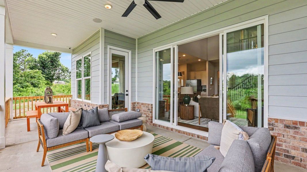 Spacious rear covered patio with ceiling fan