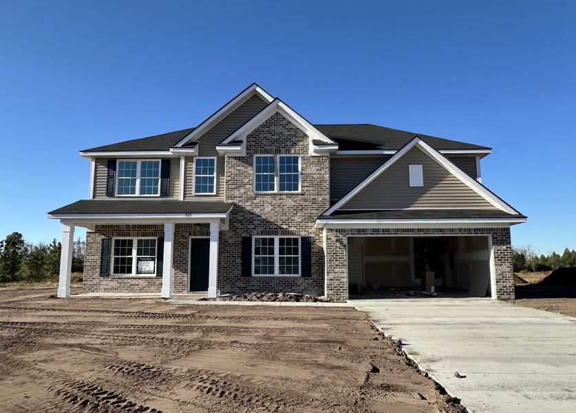 Front exterior of a new home in Tibet Road at Sassafras, Allenhurst, GA, highlighting curb appeal (Image 1).