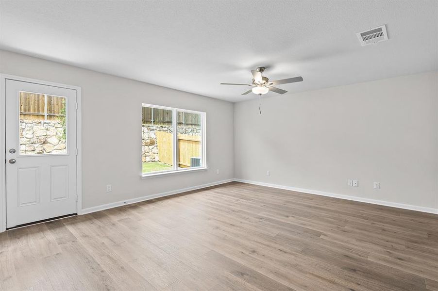 Foyer entrance featuring a ceiling fan and wood finished floors