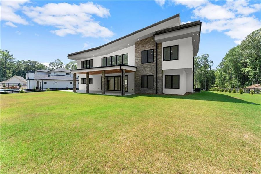 Front exterior of a new home in , Hoschton, GA, highlighting curb appeal (Image 24).