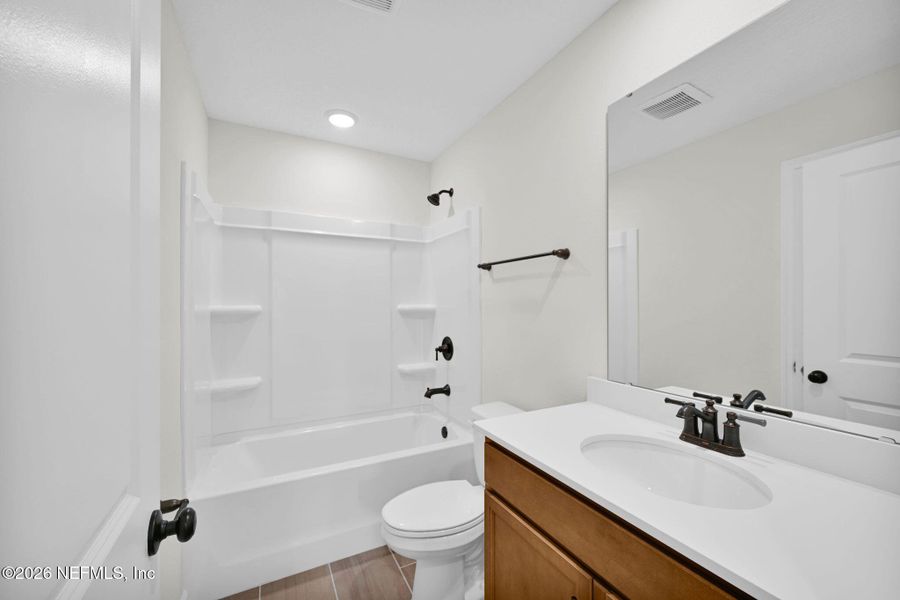 Furnished interior view inside a new home in Baxley Villas, Middleburg (Image 5).