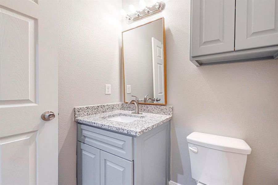 Bathroom featuring toilet and vanity