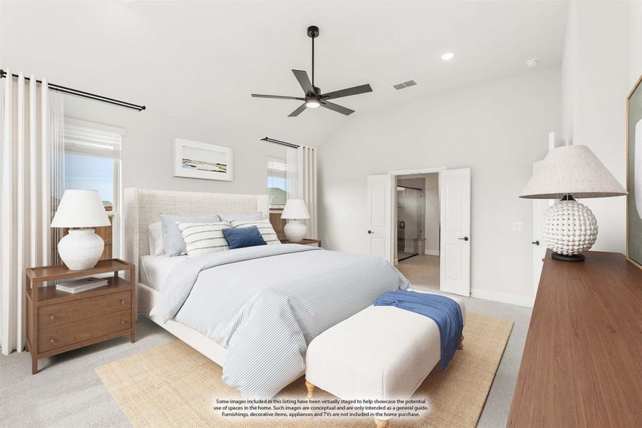 Spacious master bedroom with vaulted ceiling, ceiling fan, carpet flooring, and ensuite bathroom doorway Spacious master bedroom with vaulted ceiling, ceiling fan, carpet flooring, and ensuite bathroom doorway