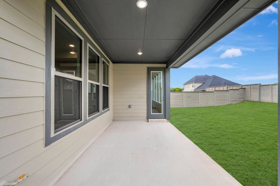 Exterior details and patio area of a home in Treeline, Justin (Image 18).