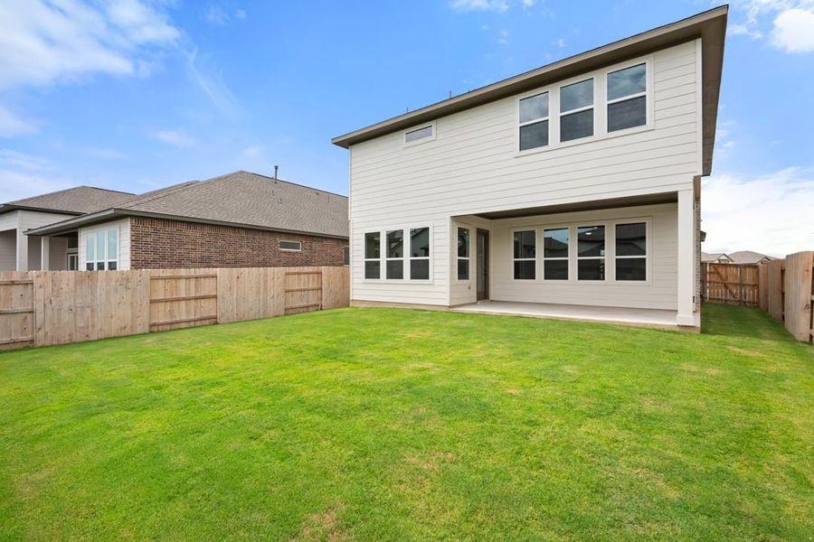 Front exterior of a new home in Arbor Collection at Lariat, Liberty Hill, TX, highlighting curb appeal (Image 24). Front exterior of a new home in Arbor Collection at Lariat, Liberty Hill, TX, highlighting curb appeal (Image 24).