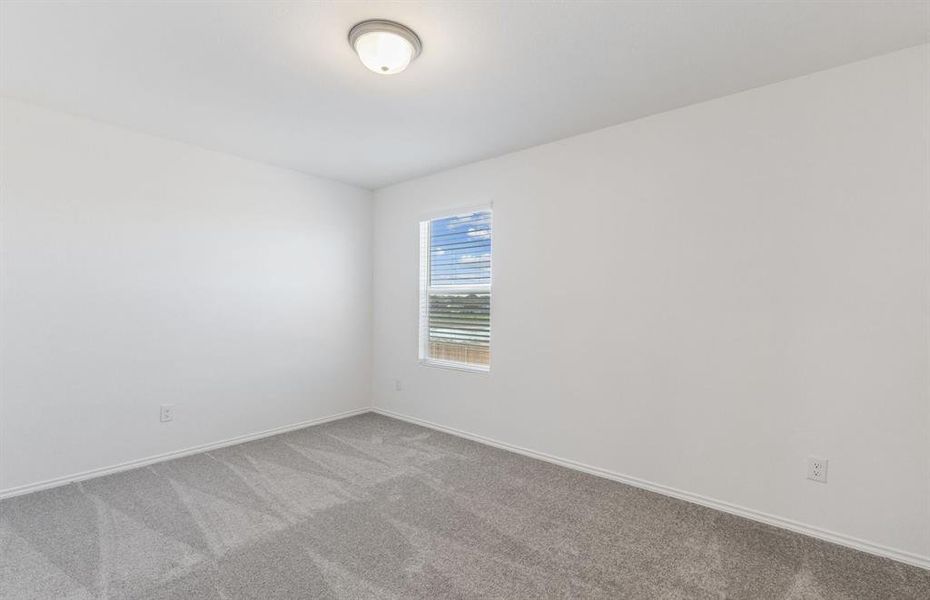 Spacious secondary bedroom with ample closet space *real home pictured