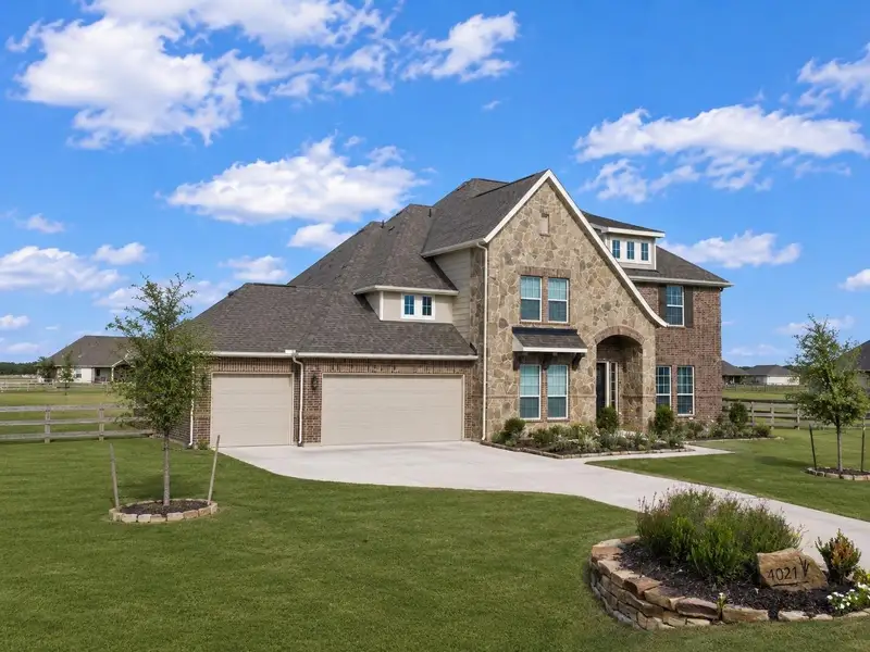 Front exterior of a new home in Lakeview, Waller, TX, highlighting curb appeal (Image 2). Front exterior of a new home in Lakeview, Waller, TX, highlighting curb appeal (Image 2).