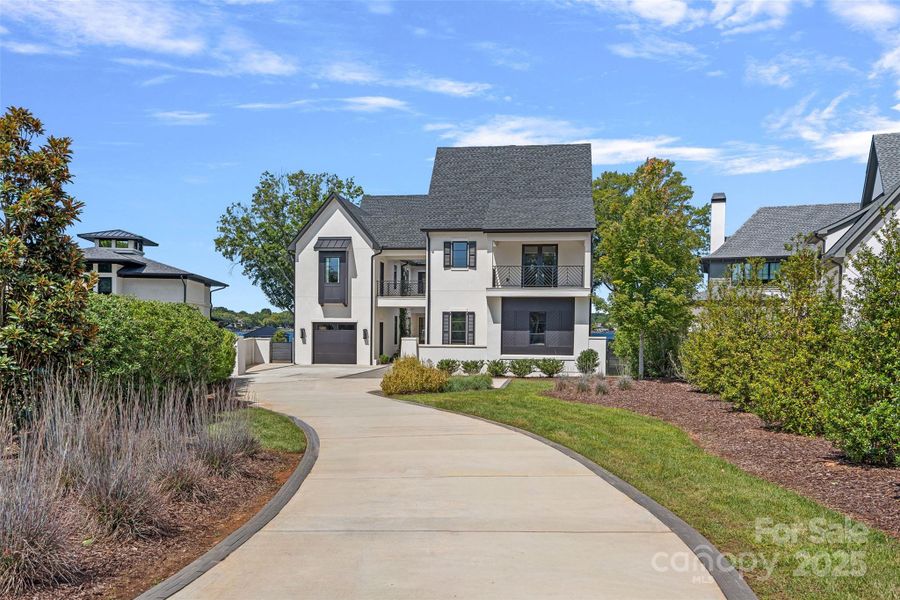 Front exterior of a new home in , Cornelius, NC, highlighting curb appeal (Image 1).