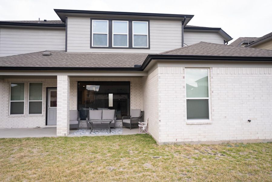 Exterior details and patio area of a home in Sunterra, Katy (Image 34).