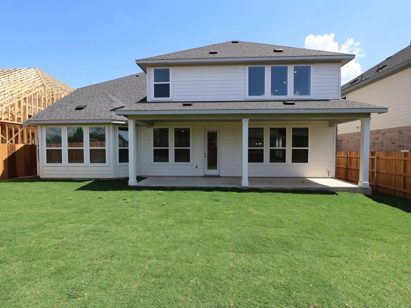 Front exterior of a new home in Edgewood, Leander, TX, highlighting curb appeal (Image 1). Front exterior of a new home in Edgewood, Leander, TX, highlighting curb appeal (Image 1).