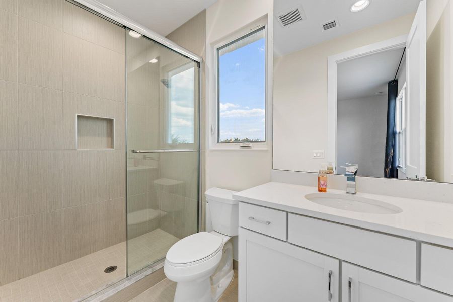 Furnished interior view inside a new home in Coral Isles at Avenir, Palm Beach Gardens (Image 9).