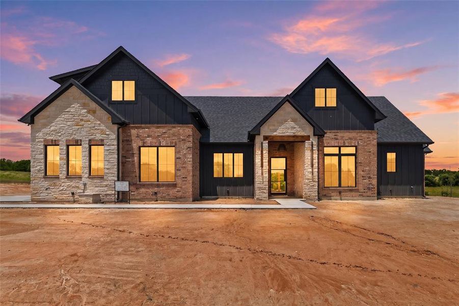 Front exterior of a new home in , Poolville, TX, highlighting curb appeal (Image 1). Front exterior of a new home in , Poolville, TX, highlighting curb appeal (Image 1).