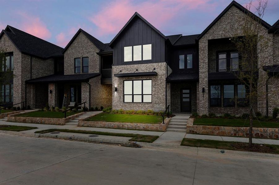 Front exterior of a new home in Ridgeline Towns, McKinney, TX, highlighting curb appeal (Image 29). Front exterior of a new home in Ridgeline Towns, McKinney, TX, highlighting curb appeal (Image 29).