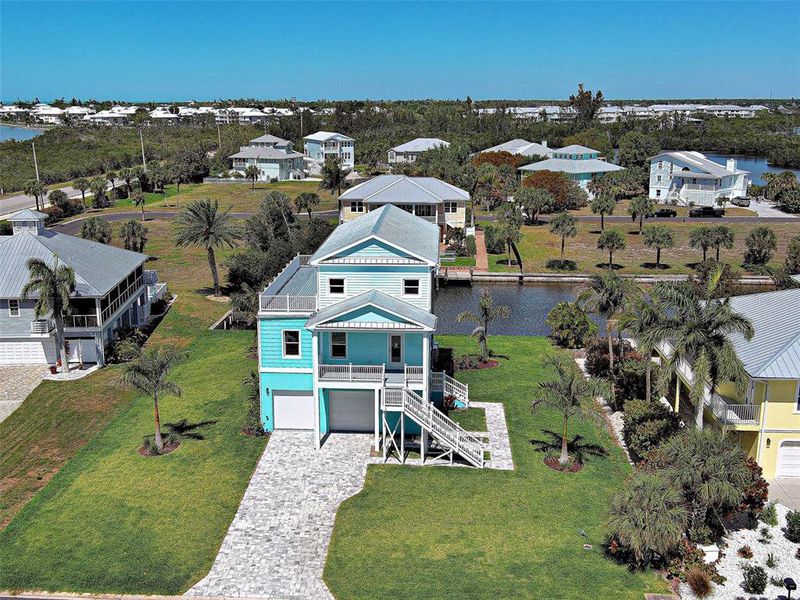 Front exterior of a new home in , Placida, FL, highlighting curb appeal (Image 30). Front exterior of a new home in , Placida, FL, highlighting curb appeal (Image 30).