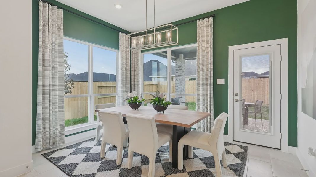 Representative furnished interior of a home built from the Adele by Chesmar Homes in Sunterra, Katy (Image 13).