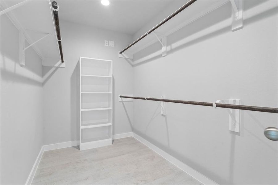 Look at this immaculate closet! With high shelving, multiple rows to hang clothing, you are sure to have enough room for all your belongings!