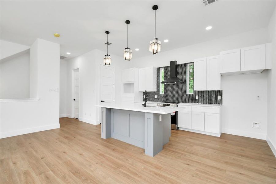 Second floor features the living room and kitchen.