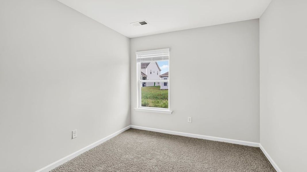 Spacious, unfurnished interior of a new home in Tanglewood Townes, Greenville (Image 25).